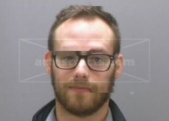 Adam J Mecomber