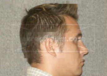 Dustin K Sharpless