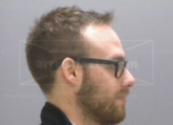 Adam J Mecomber