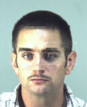Travis L Harbison